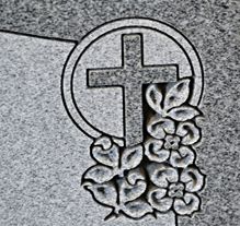Heart-shaped floral carving on granite headstone