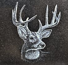 Traditional Roman lettering carved deep on granite