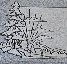 Pine trees and nature scene etching on granite