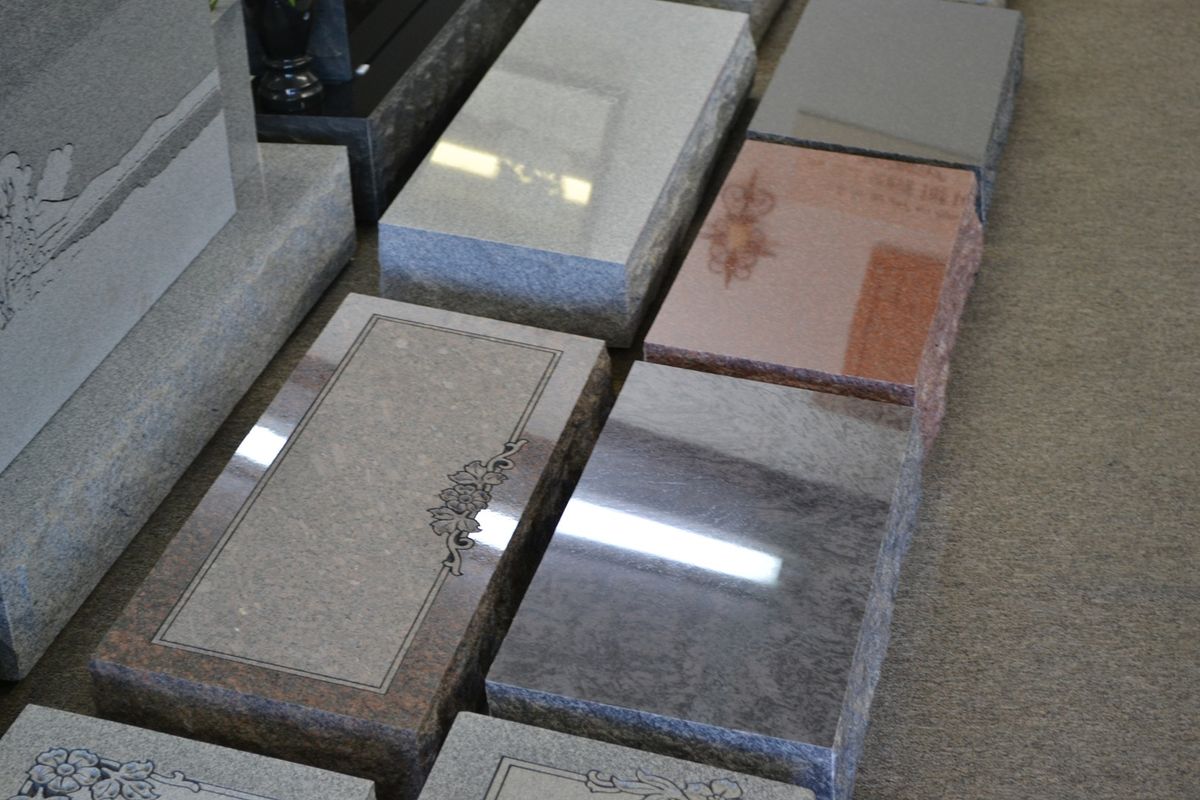 Polished granite memorial installed on concrete foundation